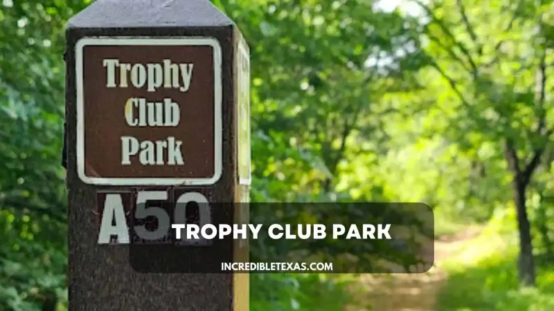 Off-road all-terrain vehicle navigating a dirt trail through wooded Cross Timbers terrain at Trophy Club Park
