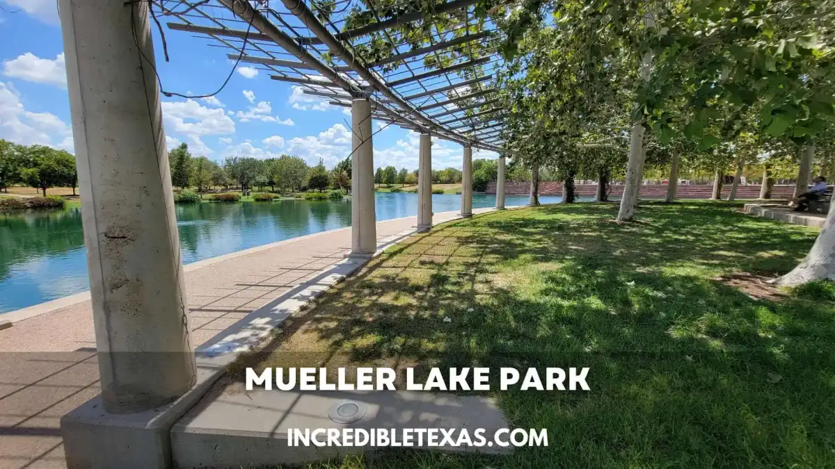 Panoramic view of Mueller Lake Park lake and walking trail with the Austin skyline in the background