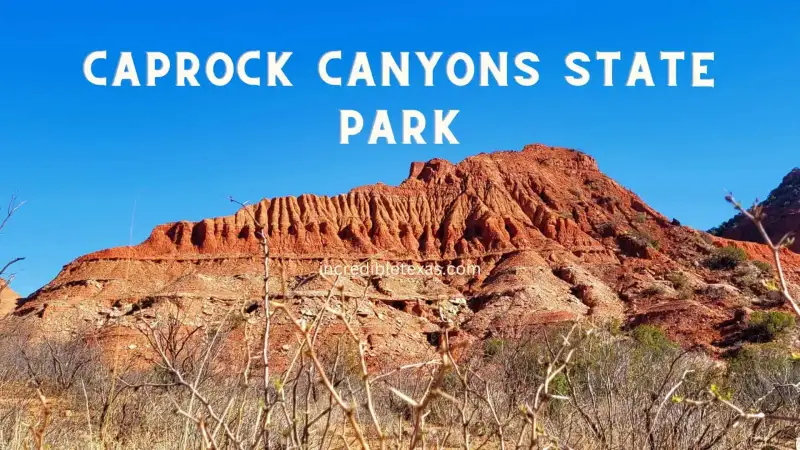 Rugged red rock cliffs and prairie landscape at Caprock Canyons State Park and Trailway