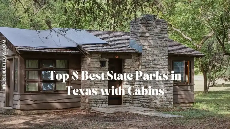 Waterfront stone cabin surrounded by towering pines at a Texas state park