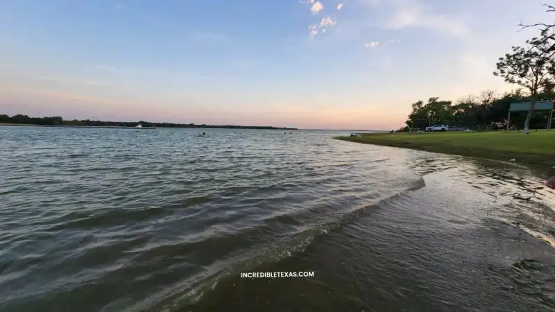 Wide open water and shoreline tree line at Lewisville Lake in North Texas