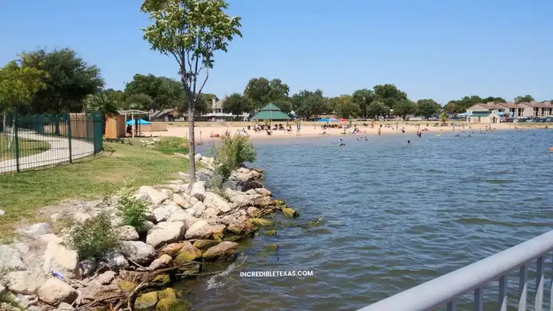 Scenic shoreline view of Lake Granbury with public boat dock and calm Brazos River water