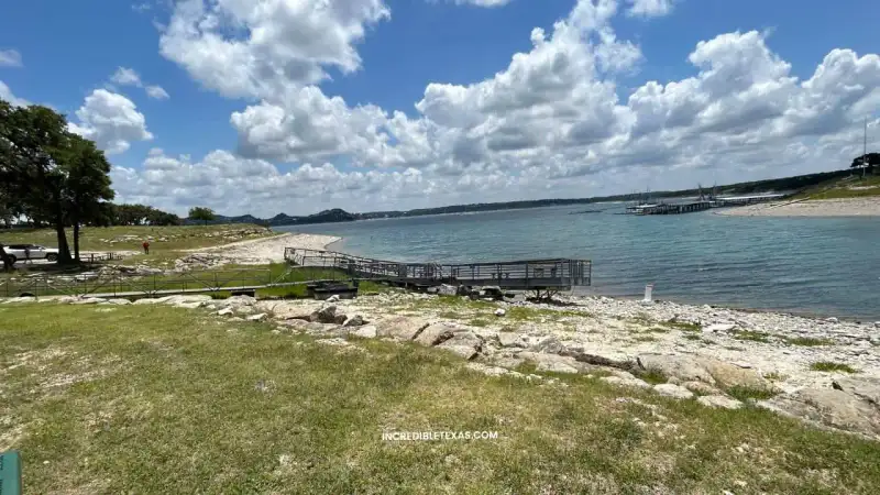 Waterfront cabins and limestone shoreline at JBSA Recreation Park along Canyon Lake in Comal County