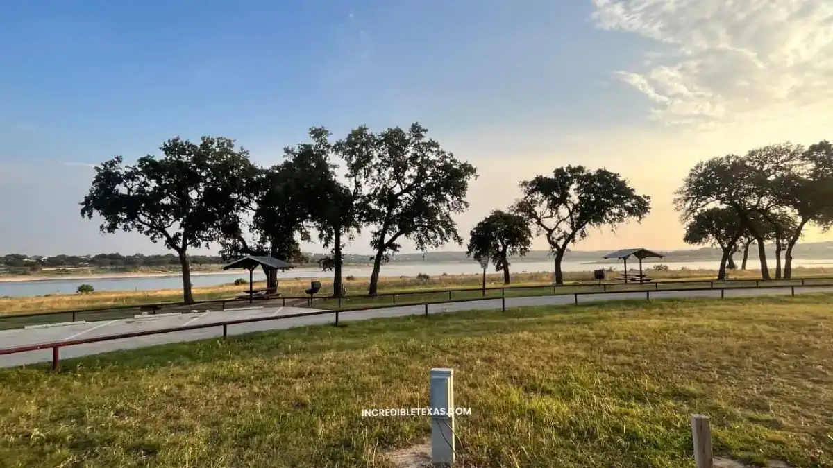 Waterfront campsite and boat ramp view at Cranes Mill Park along Canyon Lake