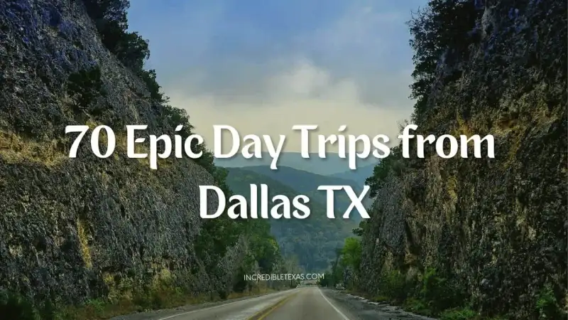 Scenic Texas two-lane highway winding through open countryside toward tree-lined hills on a clear sunny morning