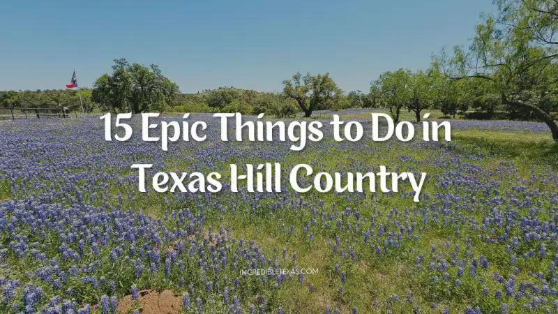 Panoramic view of limestone ridges, rolling hills, and green oak trees in the Texas Hill Country