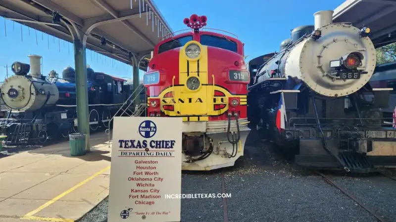 Vintage Santa Fe streamlined diesel locomotives on tracks outside Galveston Railroad Museum depot