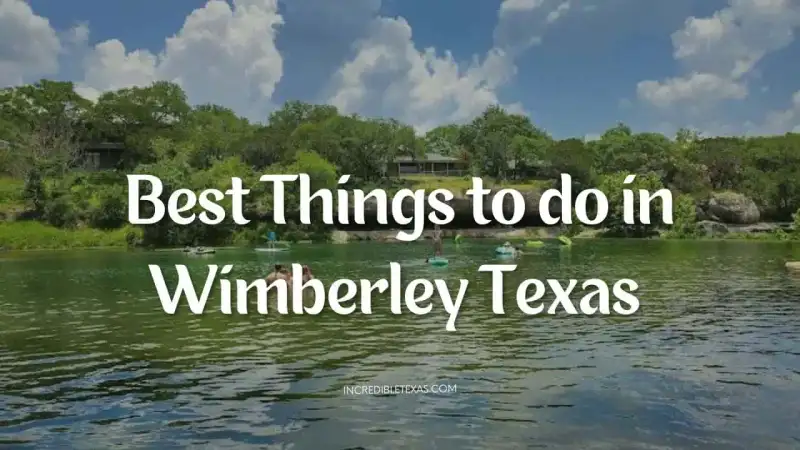 Families enjoying clear spring water shaded by cypress trees in Wimberley Texas