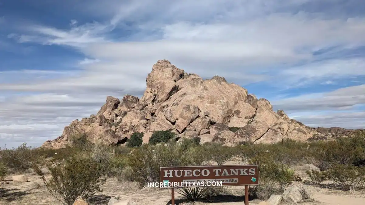 Massive syenite rock outcrops and desert trails at Hueco Tanks State Park near El Paso
