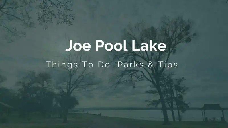 Panoramic sunset view across the calm waters, tree-lined shores, and boat docks of Joe Pool Lake