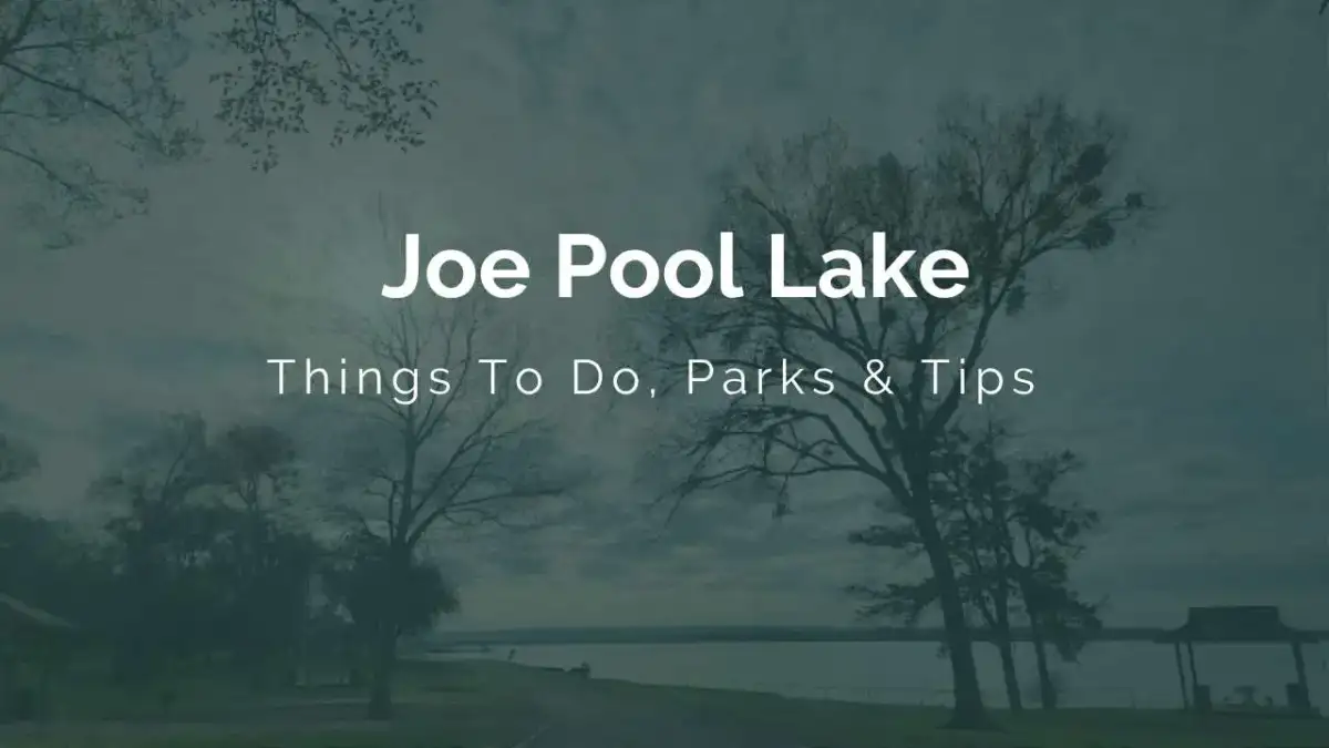 Panoramic sunset view across the calm waters, tree-lined shores, and boat docks of Joe Pool Lake