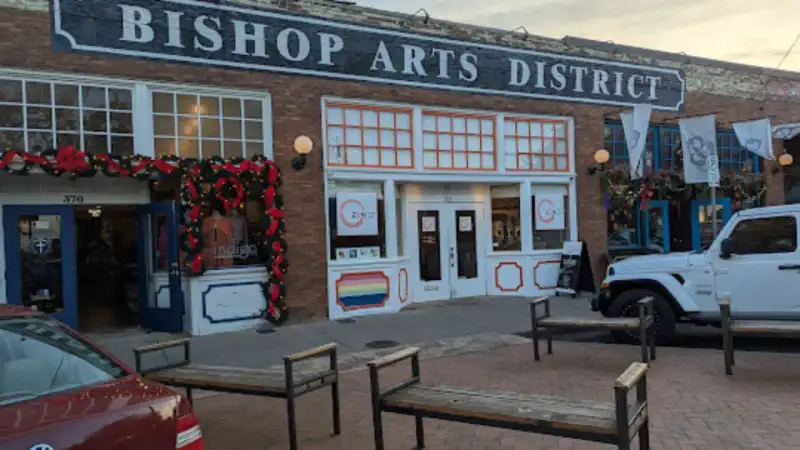 Tree-lined historic brick storefronts, boutiques, and outdoor dining patios in Bishop Arts District Dallas