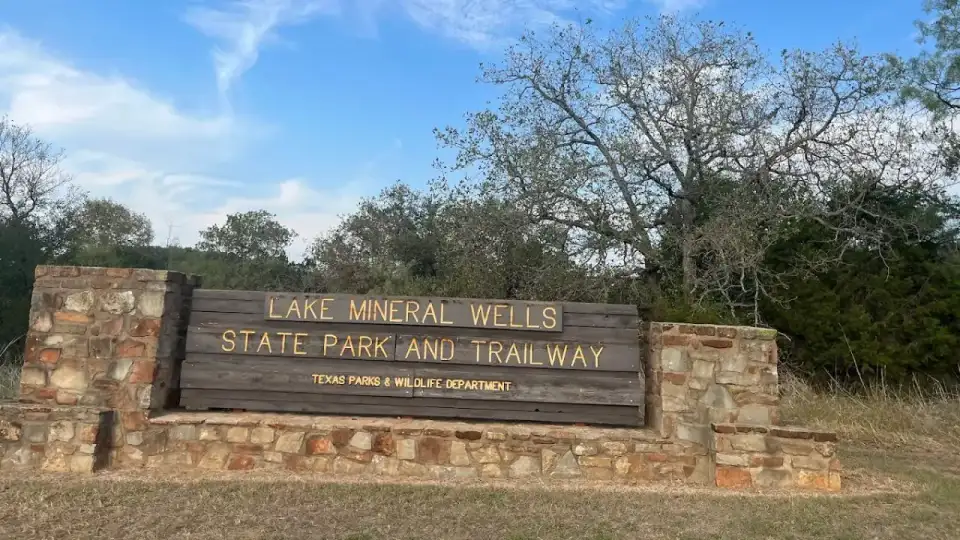 Lake Mineral Wells State Park shoreline bluffs and calm lake water framed by Cross Timbers woodland