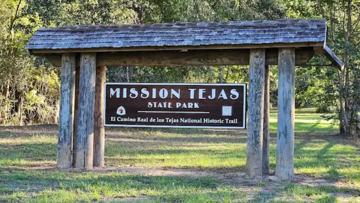 Commemorative wooden replica of Mission San Francisco de los Tejas under Pineywoods canopy