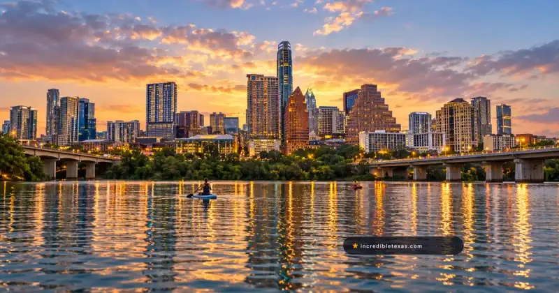 Downtown Austin skyline reflects across Lady Bird Lake at sunset