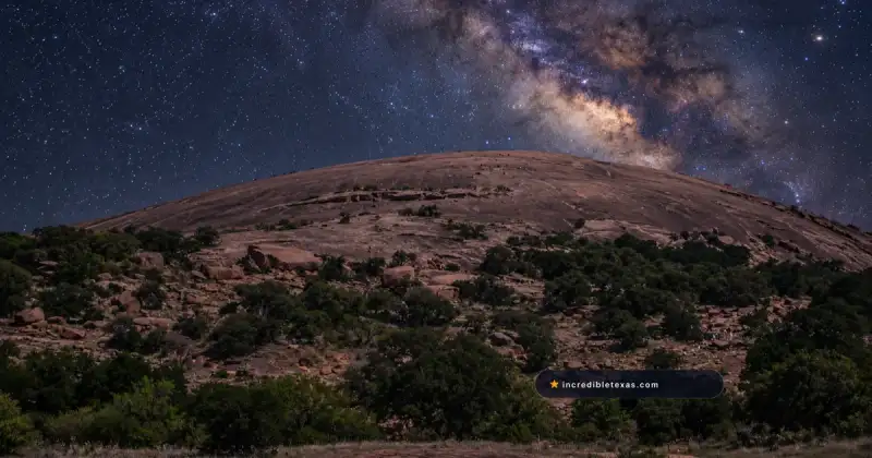 Rounded pink granite summit at Enchanted Rock beneath the Milky Way in the Texas Hill Country