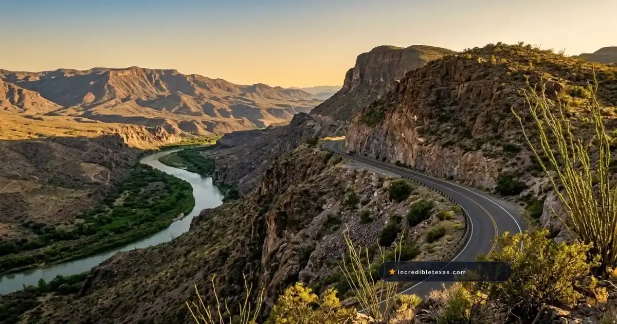 Paved highway curves along rugged desert canyon cliffs overlooking the Rio Grande on FM 170