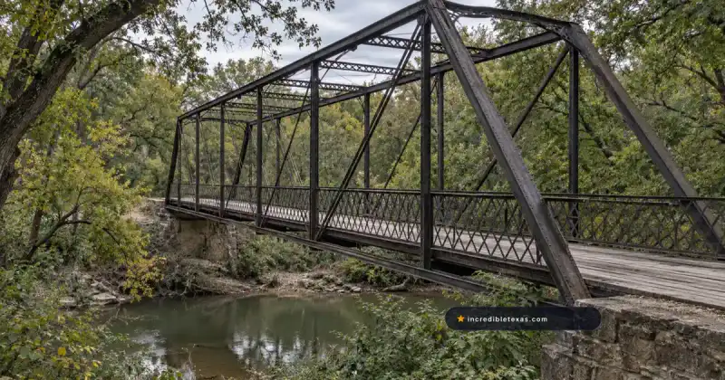 Old Alton Bridge’s iron truss span crossing Hickory Creek near Denton, Texas