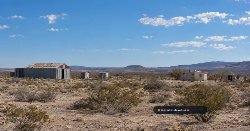 Weathered metal buildings and desert scrub at Lobo, Texas, along US 90
