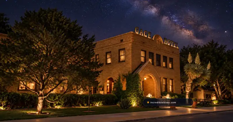 Tan brick facade and arched entrance of the Gage Hotel beneath the Milky Way in Marathon, Texas