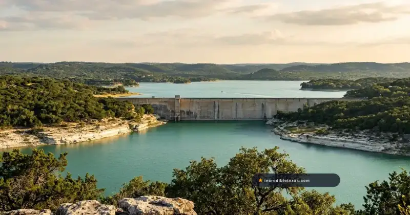 Limestone canyon cliffs and cypress-lined shoreline along Medina Lake in the Texas Hill Country near Mico