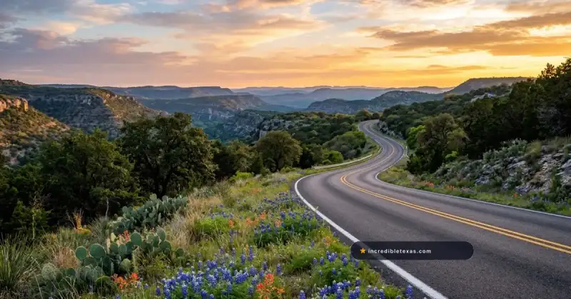 Scenic highway winding through the rugged Texas mountain landscape at sunset