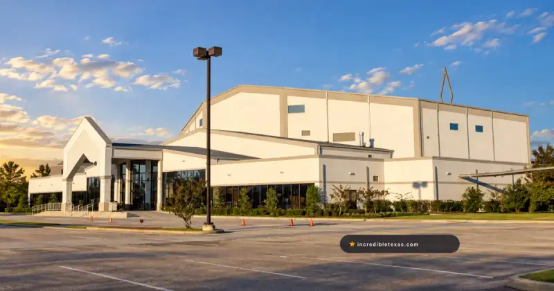 New Light Christian Center Church in Houston, with its white sanctuary, peaked entrance, and broad parking area