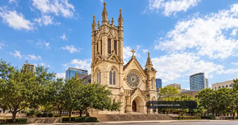 Saint Mary Cathedral in downtown Austin, with its limestone tower, Gothic entry, and large rose window