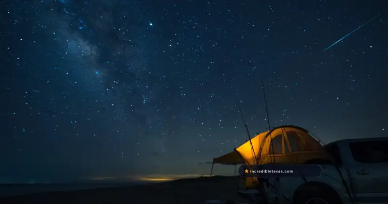Tent, pickup truck, and beach camping gear under the stars at Padre Island National Seashore, Texas