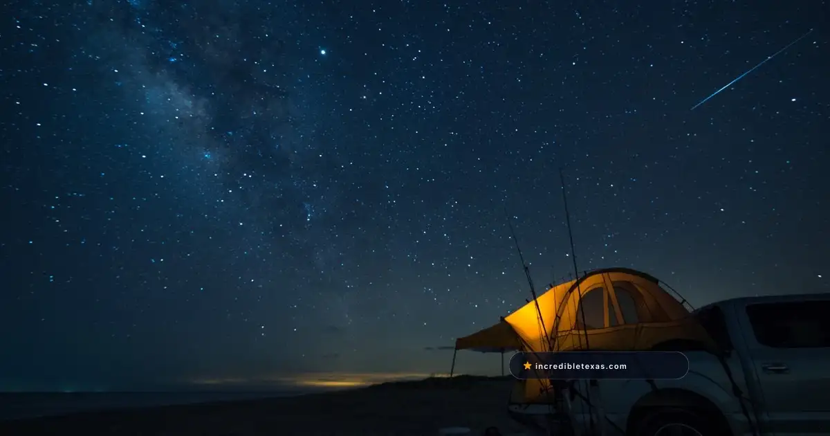 Tent, pickup truck, and beach camping gear under the stars at Padre Island National Seashore, Texas