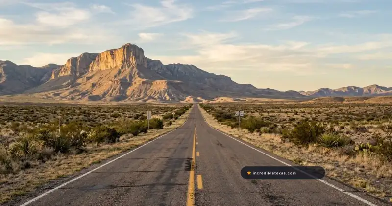 Straight two-lane highway stretches across the West Texas desert toward the towering limestone cliffs of El Capitan
