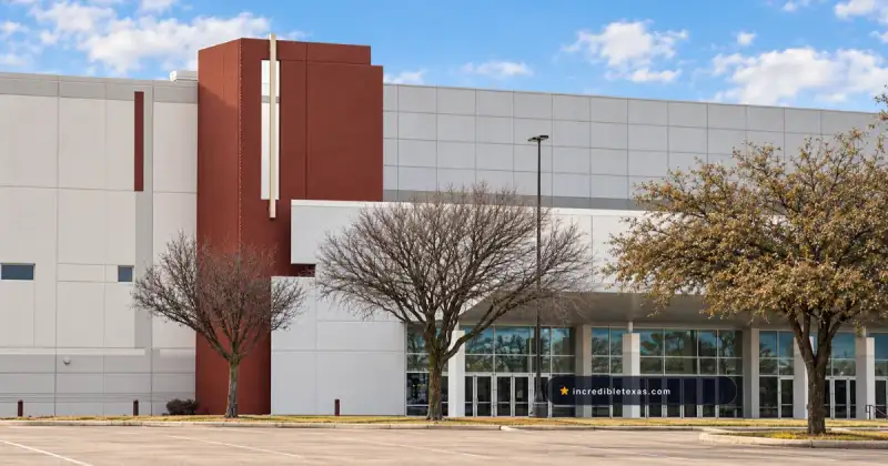 The Potter’s House Dallas campus on Kiest Boulevard, with its tall red-brown facade and glass entrance