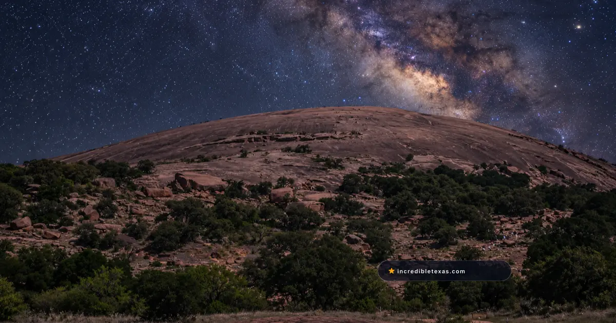 Rounded pink granite summit at Enchanted Rock beneath the Milky Way in the Texas Hill Country