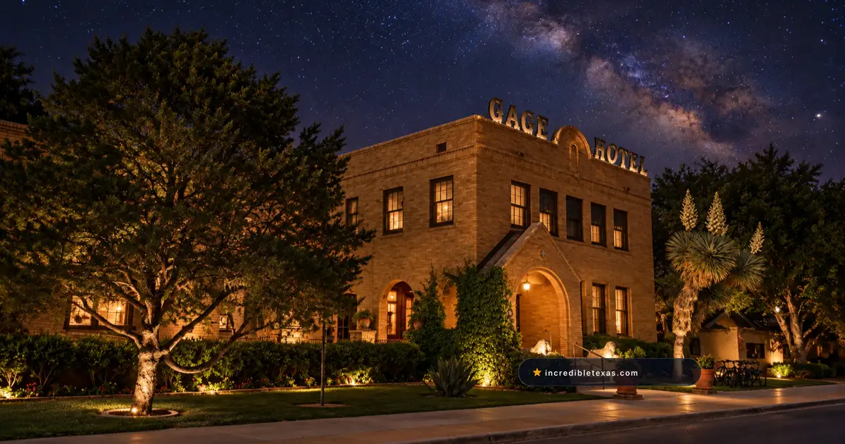 Tan brick facade and arched entrance of the Gage Hotel beneath the Milky Way in Marathon, Texas