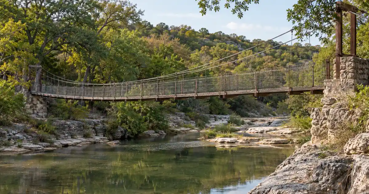 Historic wire suspension bridge over the Paluxy River at Bluff Dale, Erath County, Texas