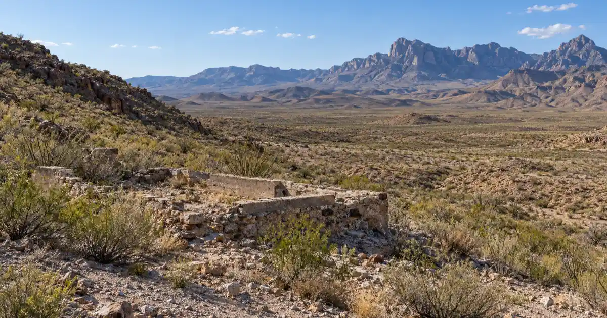 Low stone foundations and desert scrub in the former Shafter silver-mining district