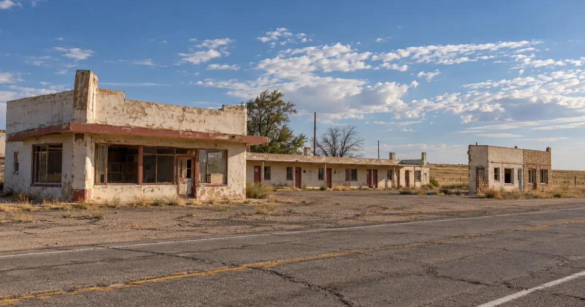 Weathered former motel buildings beside Route 66 in Glenrio Historic District